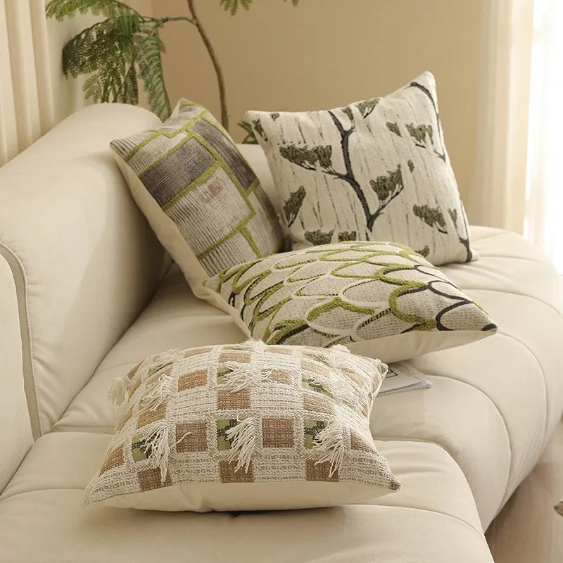 Square jacquard pillow with botanical floral pattern, shown in one of eight available colour options.