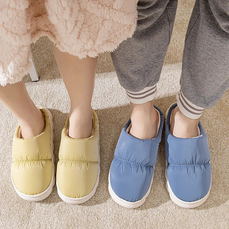 Blue couple's winter slippers with artificial leather upper, plush lining, and thick rubber anti-slip sole.