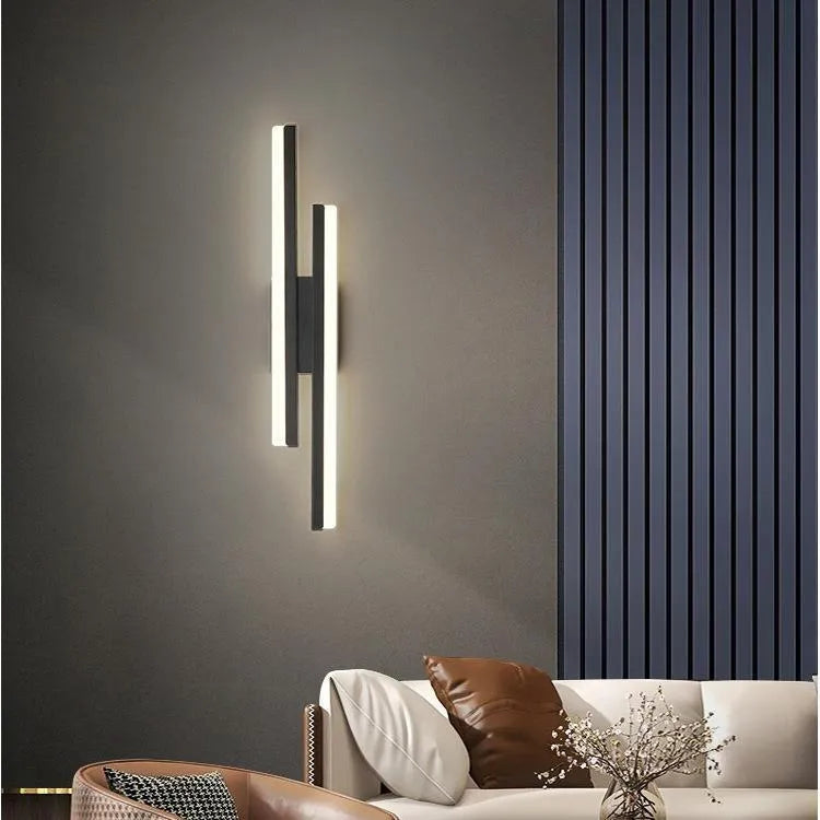Modern minimalist LED wall light with acrylic shade in black or gold finish showing 50cm and 65cm size options
