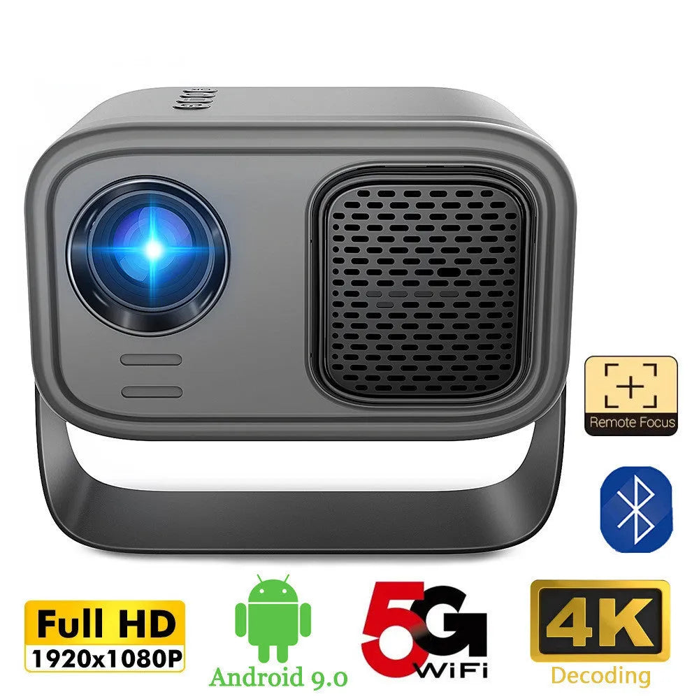 Black portable smart projector with remote control and cables on desk