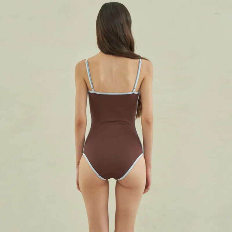 Brown women's triangle top one-piece swimsuit in nylon fabric showing front design
