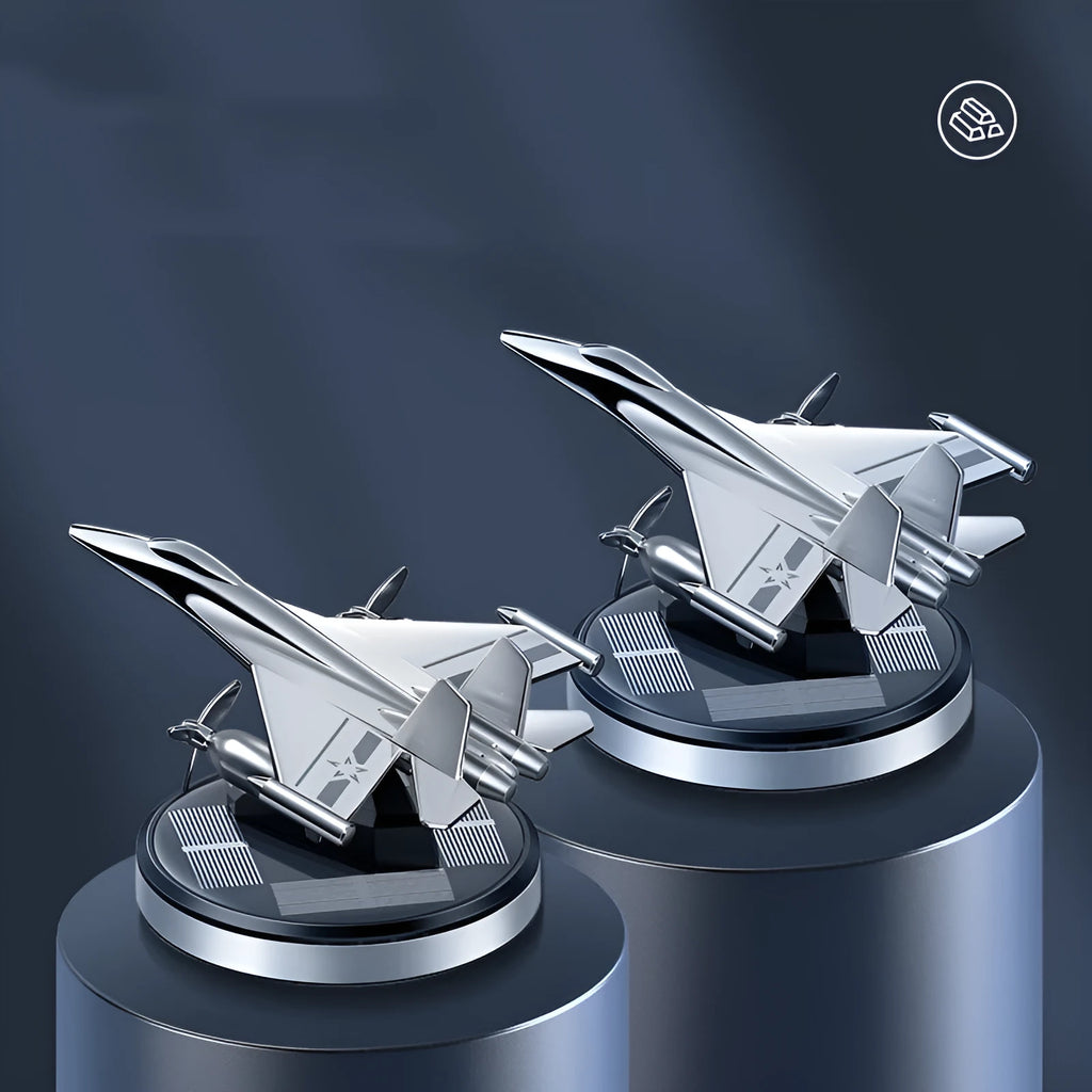 Solar powered silver rotating fighter jet model perfume ornament for car dashboard.