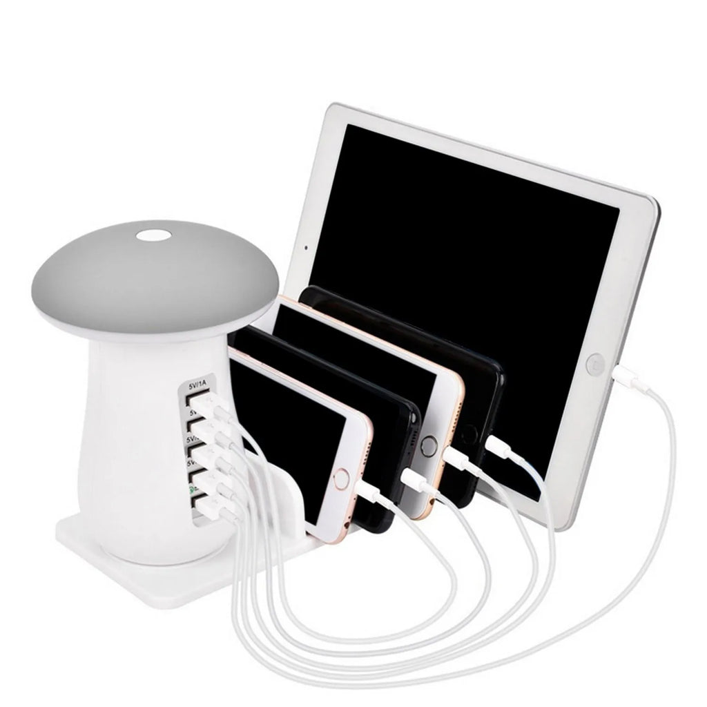 White mushroom-shaped LED lamp and 5-port USB charging dock station on a wooden desk.