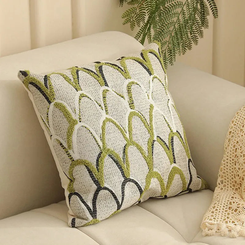 Square jacquard pillow with botanical floral pattern, shown in one of eight available colour options.