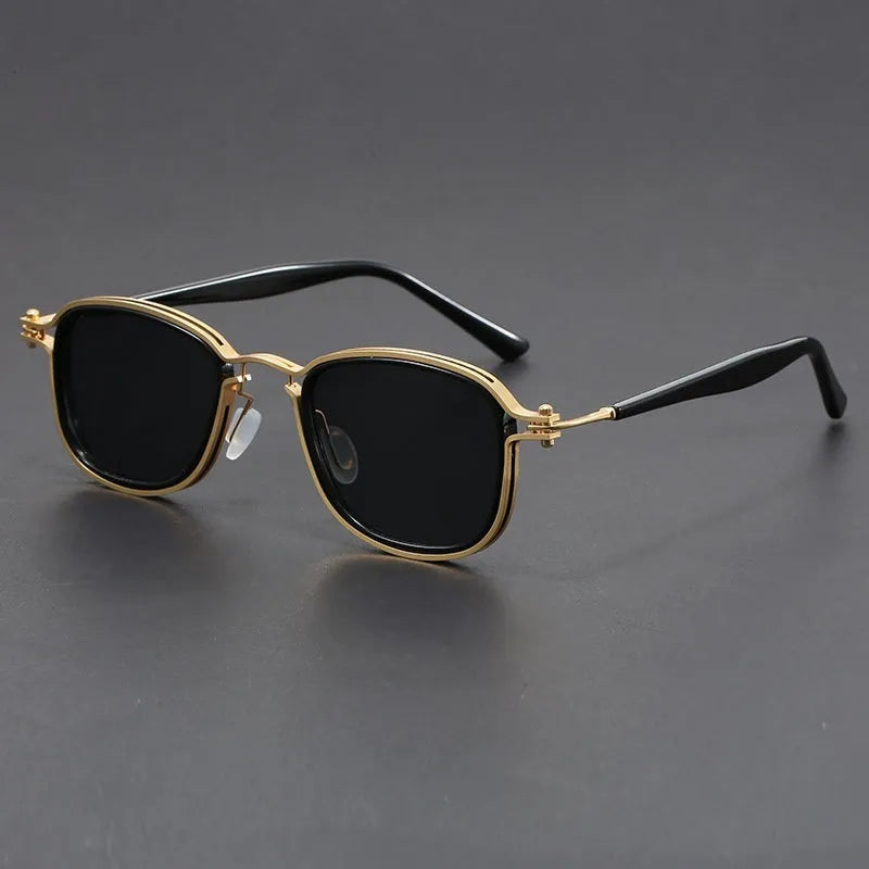 Retro square frame sunglasses with AC lenses in a black gold and grey colour combination.