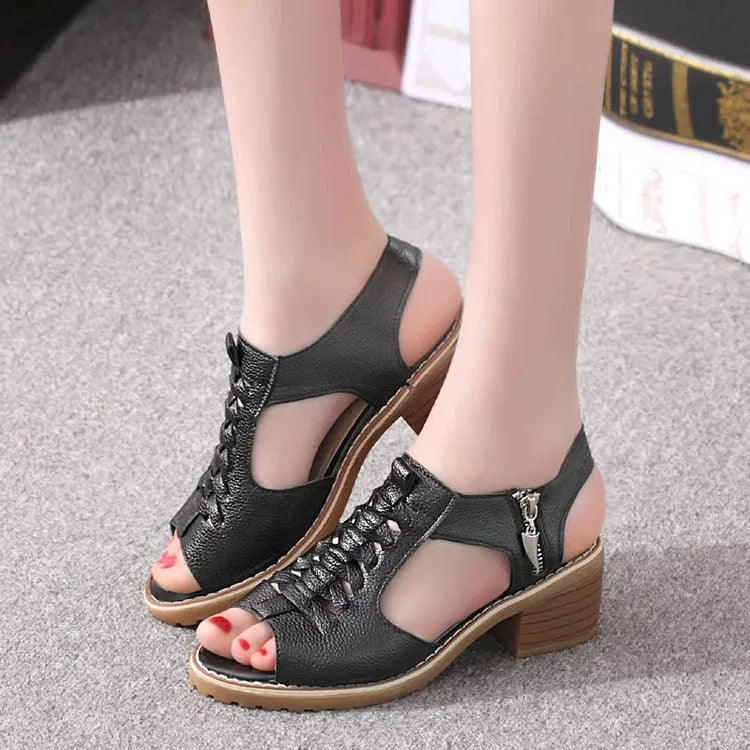 Women's black retro sandals with a side zipper and a middle heel.
