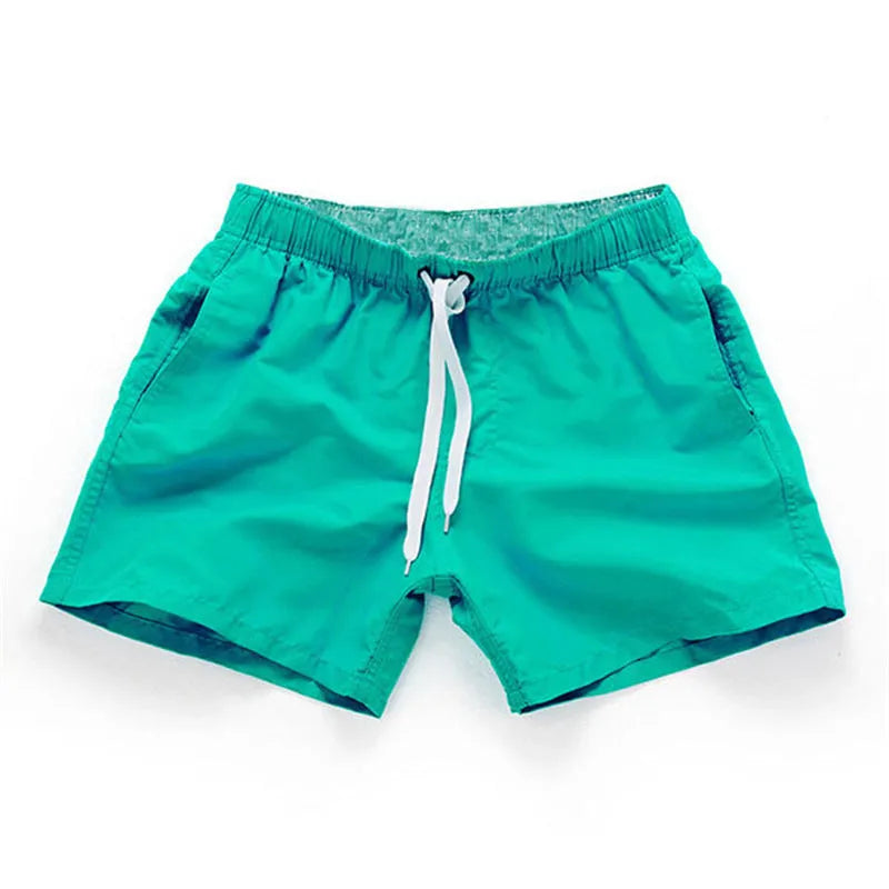 Men's polyester beach shorts in multiple colours with straight leg opening, suitable for surfing and swimming