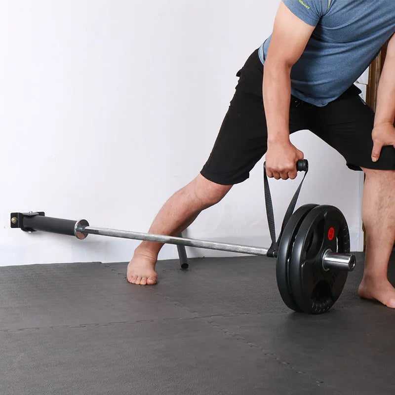 Steel wall-mounted rack holding multiple vertical barbell rods on a garage wall.