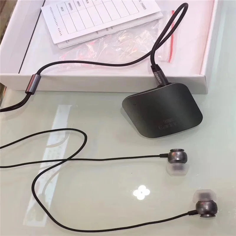Bluetooth lavalier headset clipped to clothing showing wireless design