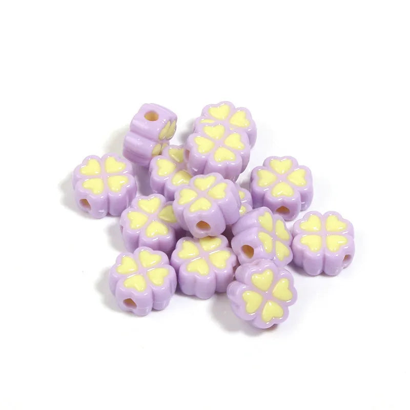 Acrylic clover craft beads with frosted finish in mixed colours including pink, blue and green