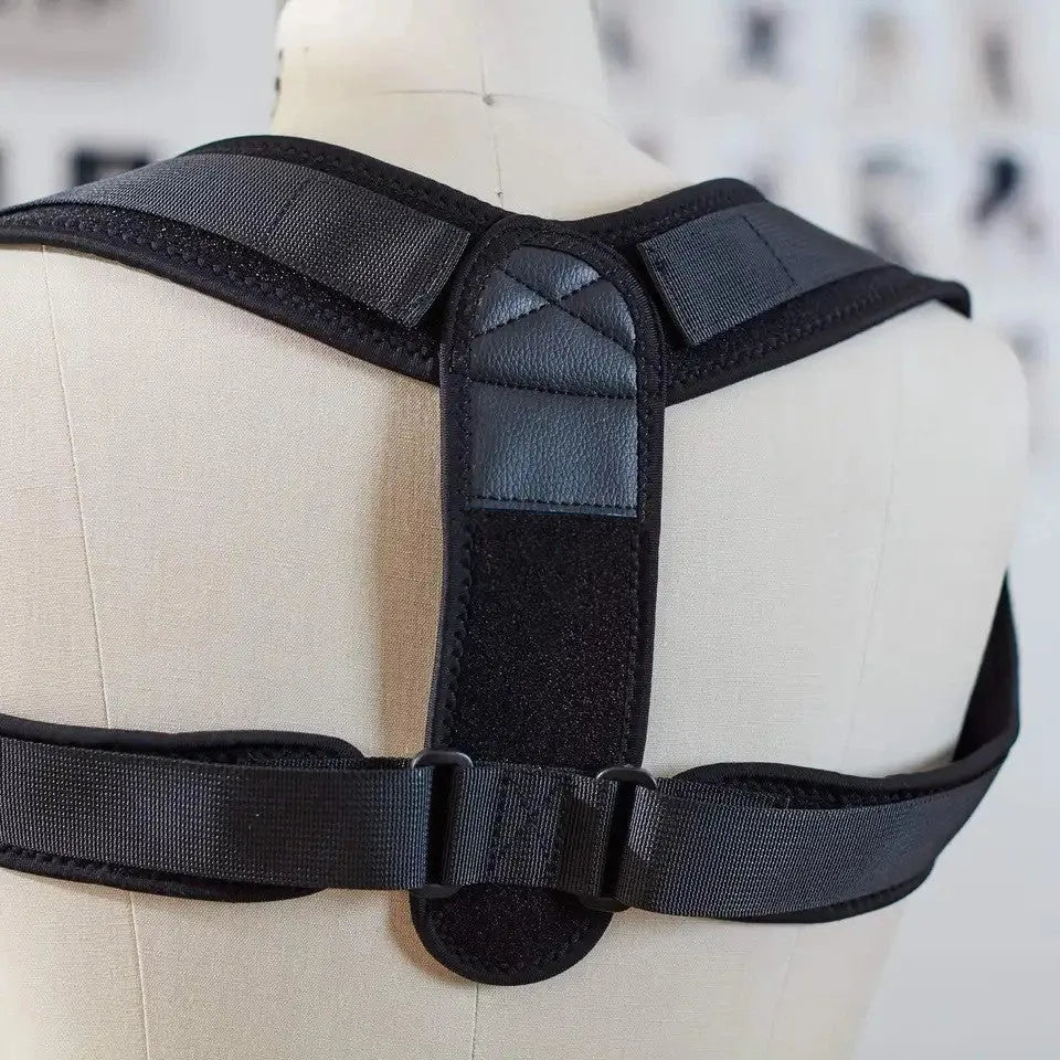 Black adjustable posture correction strap for back support.