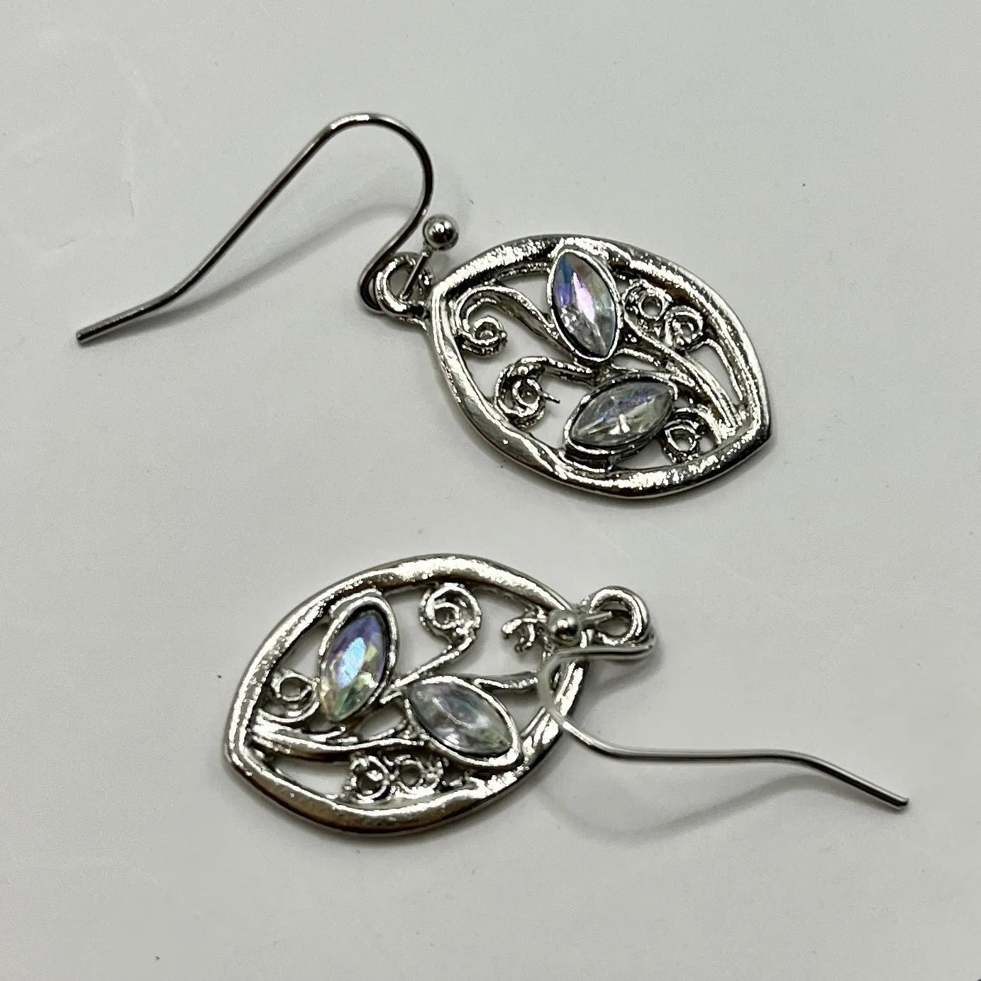 Women's silver alloy earrings with leaf designs and embedded colourful moonstones