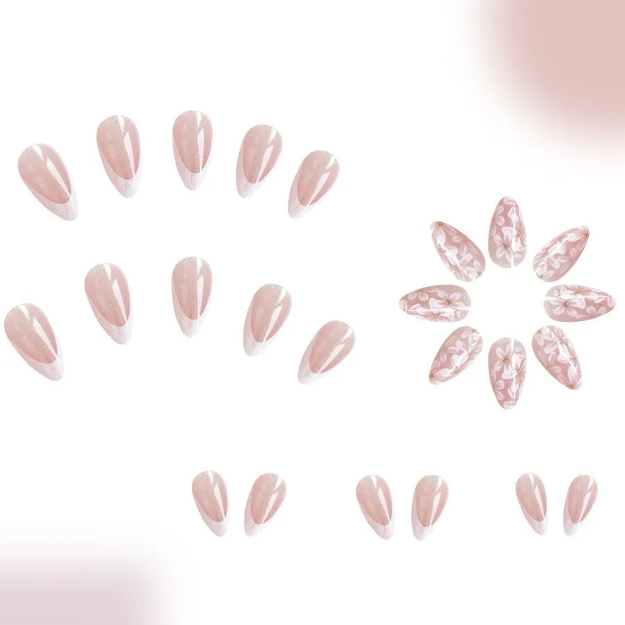 Short almond shaped false nails with glossy finish and glitter flower French tip design colour C625
