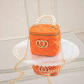 White PVC bucket-shaped cosmetic bag with a red heart pattern, zipper open.