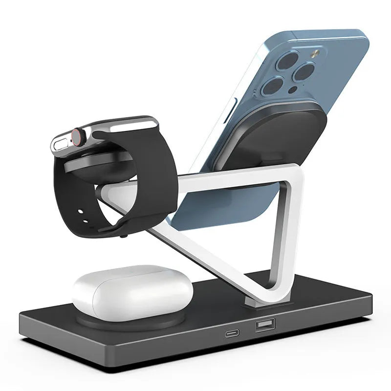 White five-in-one wireless charging station with magnetic phone bracket, circular charger, watch pad, and night lamp on desk.