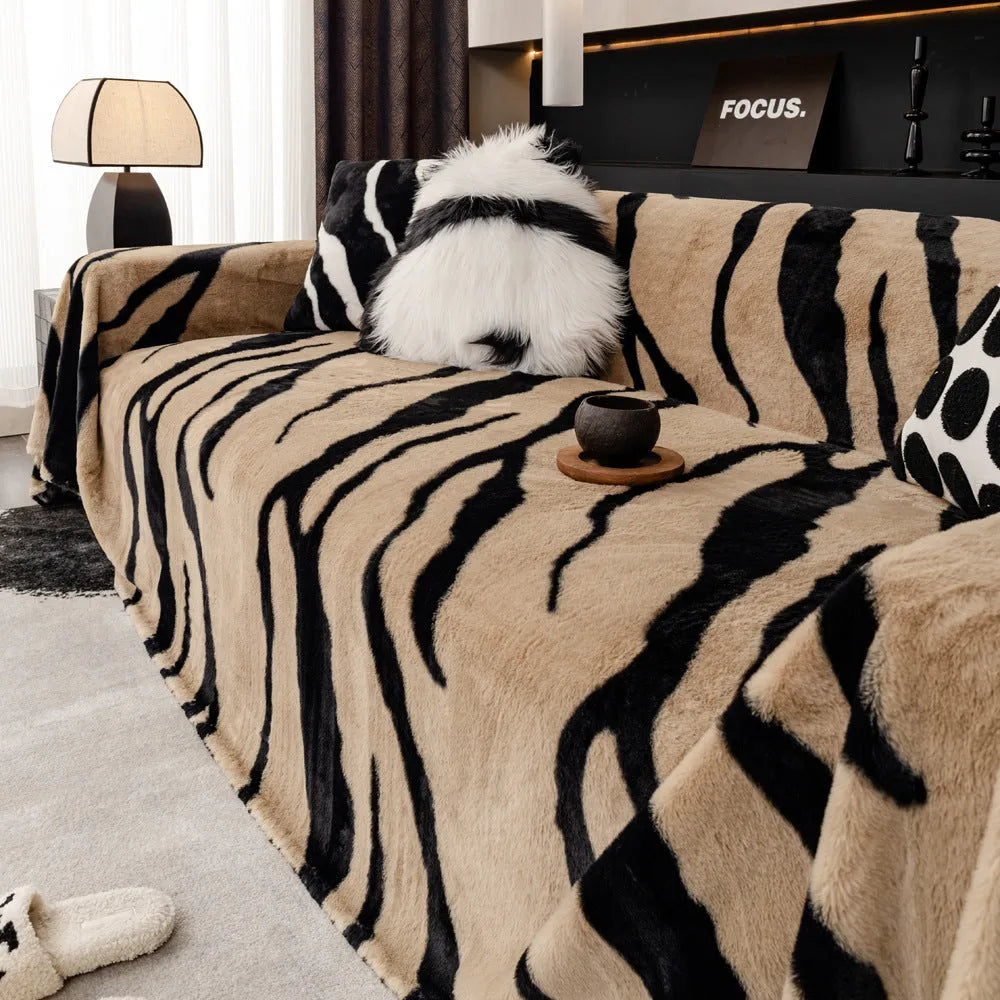 Zebra pattern flannel sofa cover with non-slip properties in caramel colour on a sofa