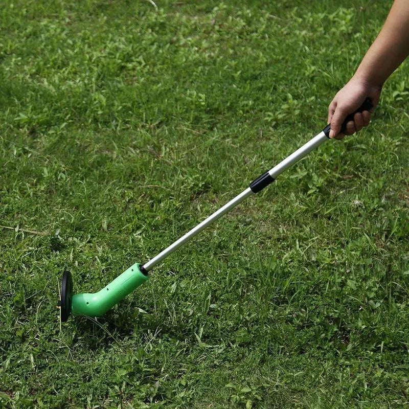Cordless Zip Trim lawn trimmer with extension pole and protective shield on garden grass