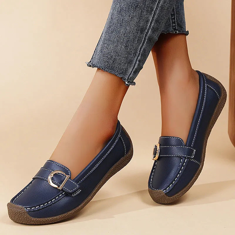 Women's beige casual loafers with a round toe and flat heel on a soft beef tendon sole.