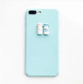 Soft pink silicone iPhone case with a raised 3D cartoon cat design on the back.