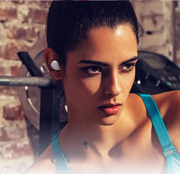 Black and white M18 true wireless in-ear Bluetooth headset with compact charging case.