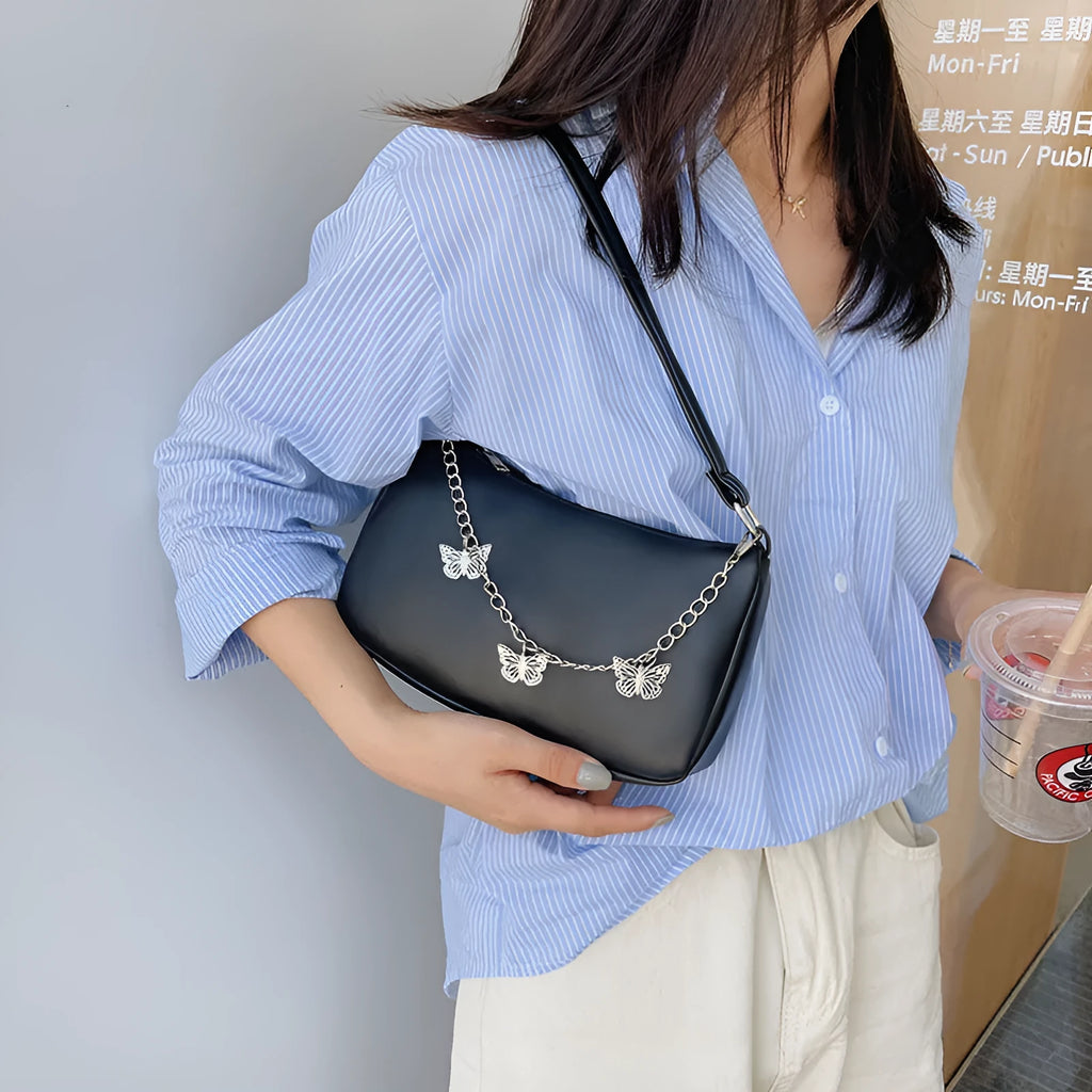 Horizontal square PU leather chain crossbody bag in light blue with an external pocket.