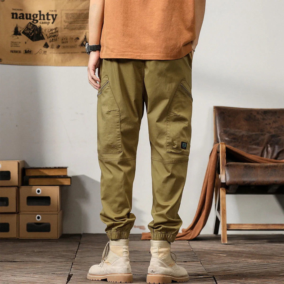 Men's cotton harem pants in khaki with tapered legs and ankle band.