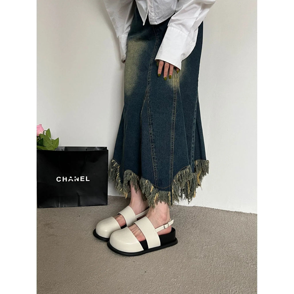 Retro brown platform sandals with a single ankle strap buckle and closed round toe.