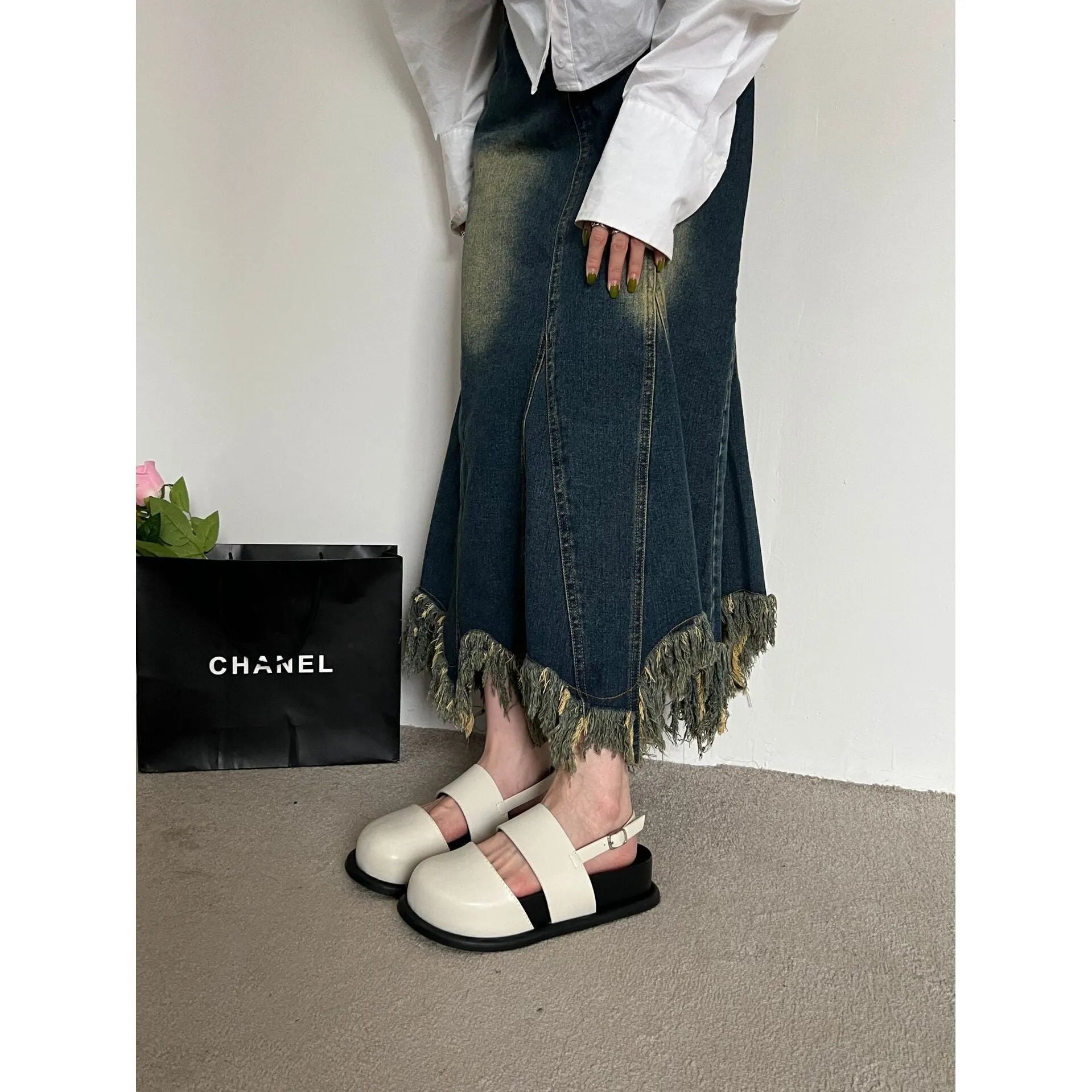 Retro brown platform sandals with a single ankle strap buckle and closed round toe.