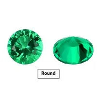 A loose cultivated emerald gemstone in Columbia green treasure colour on a white background.