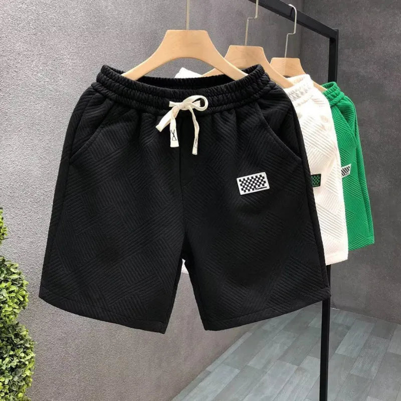 Men's white casual sports shorts with micro elasticity fabric on man at beach