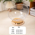 Transparent acrylic space capsule cat bed on turntable base with cat inside