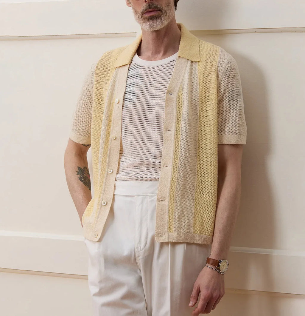 Yellow men's casual polo shirt with asymmetric design and short sleeves made from Tencel fabric.