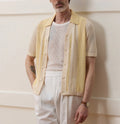 Yellow men's casual polo shirt with asymmetric design and short sleeves made from Tencel fabric.