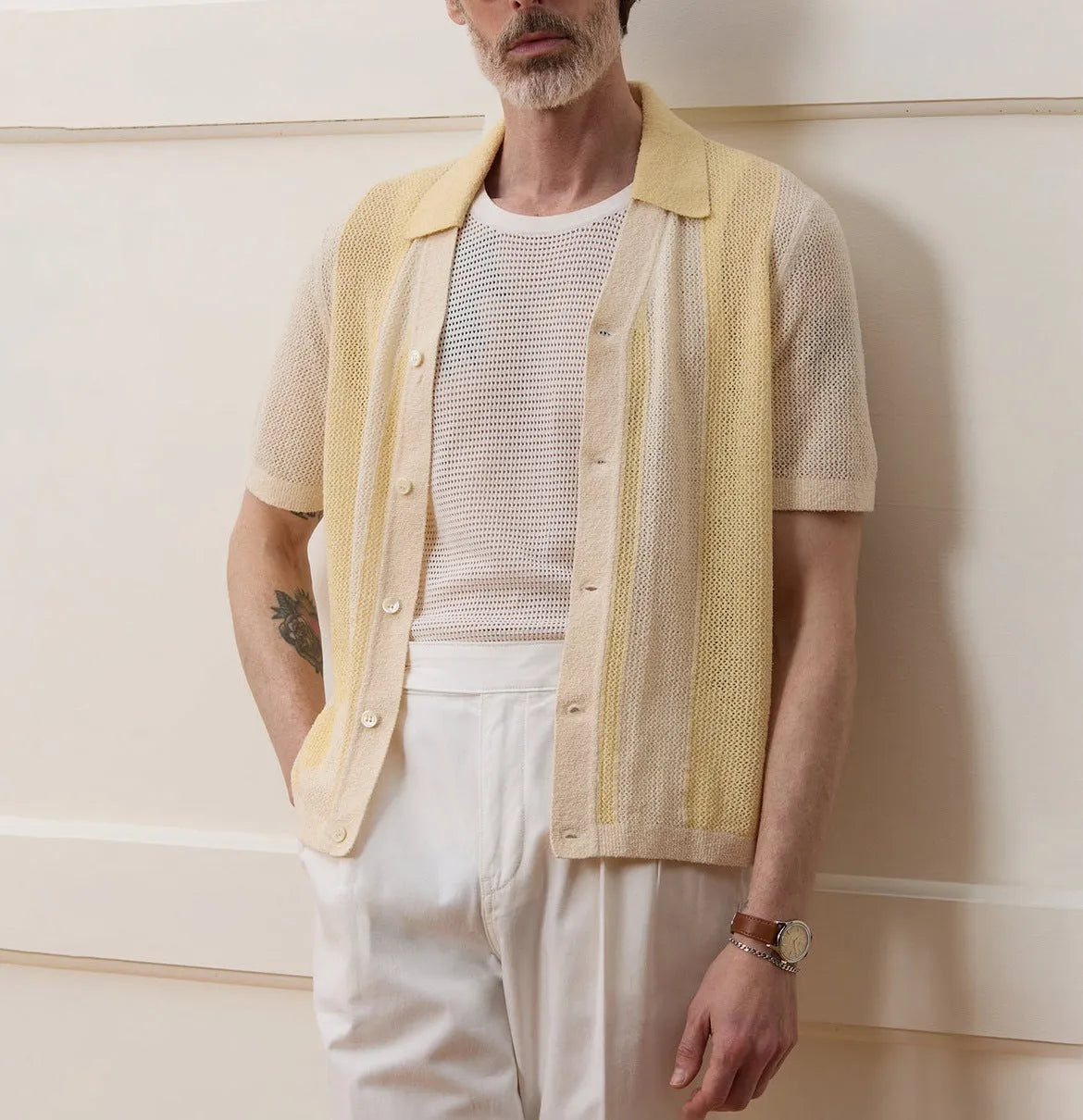 Yellow men's casual polo shirt with asymmetric design and short sleeves made from Tencel fabric.
