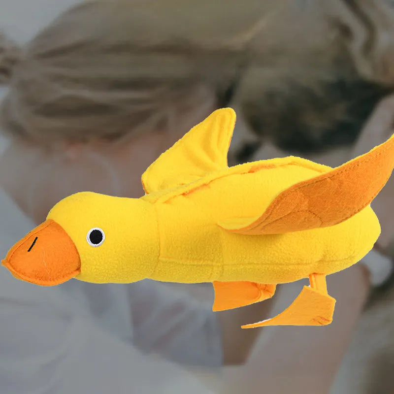 Yellow plush duck dog toy with a treat compartment and built-in sound module for training and enrichment.