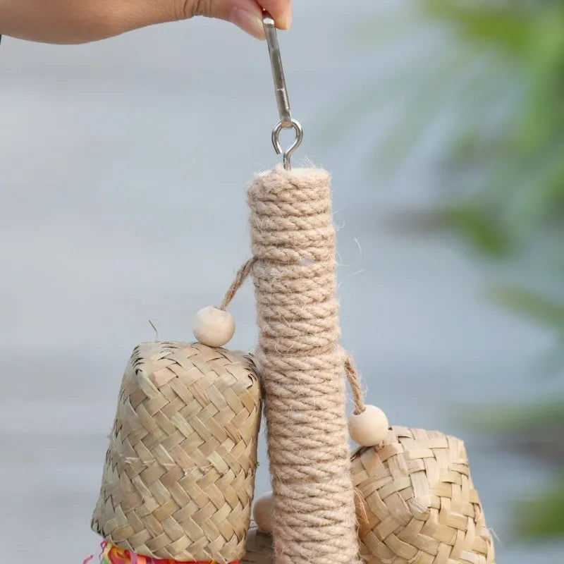 Colourful shredded paper parrot toy with wood and sisal construction hanging