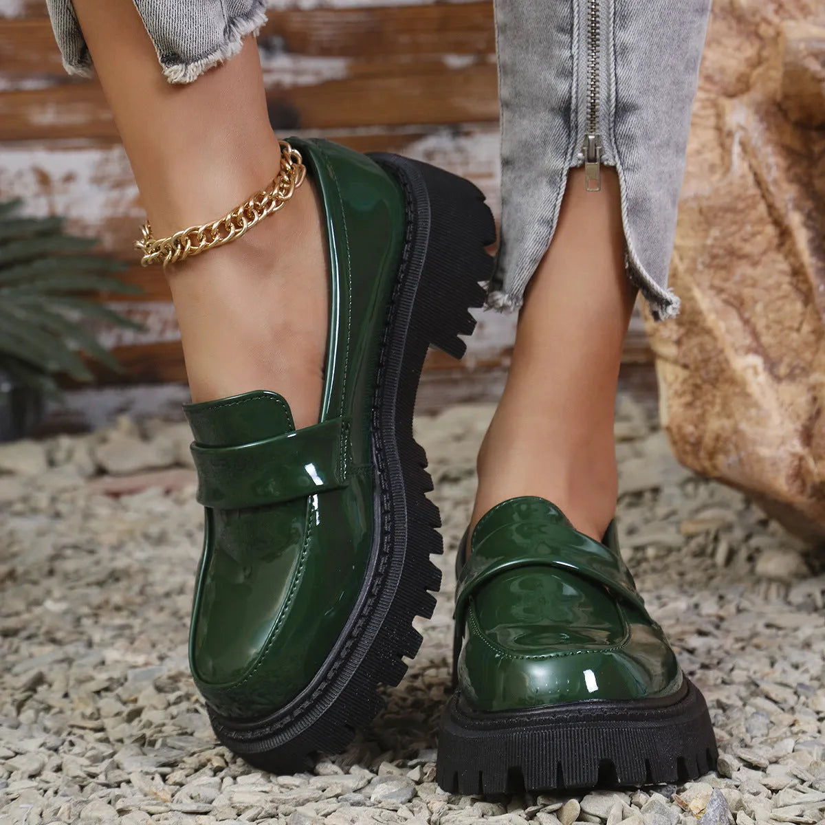 Women's black chunky heel slip-on loafers with a platform rubber sole.