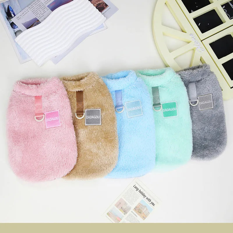 A blue coral fleece pet jacket for dogs or cats fastened with multicoloured pull rings.