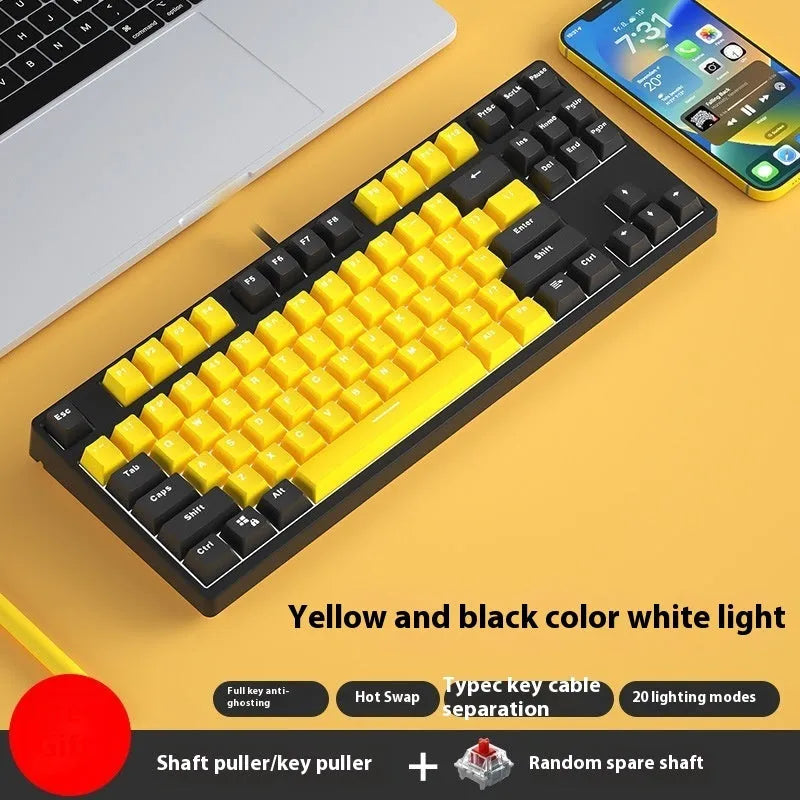 87 key wired mechanical keyboard with metal chassis shown in a black, orange, and yellow colour configuration.
