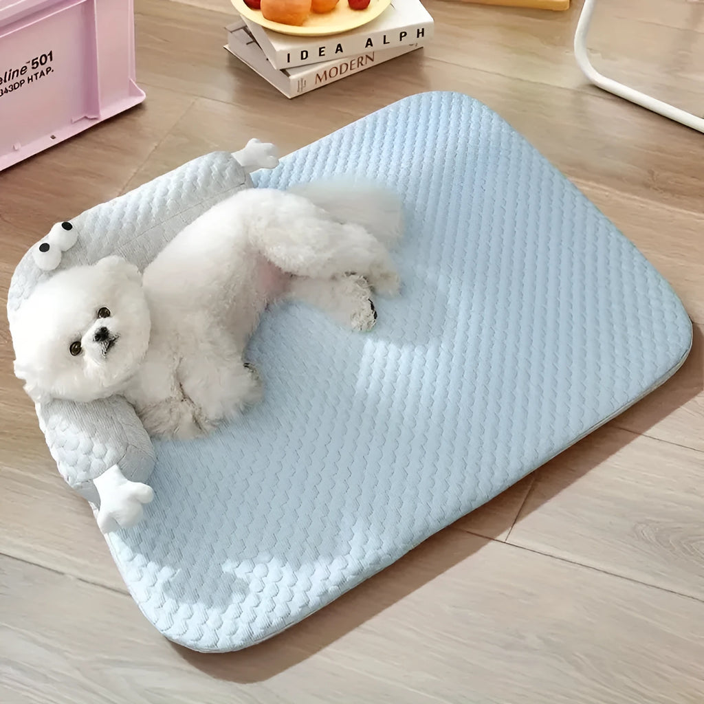 Blue and yellow monster face design pet bed for dogs and cats on a wooden floor