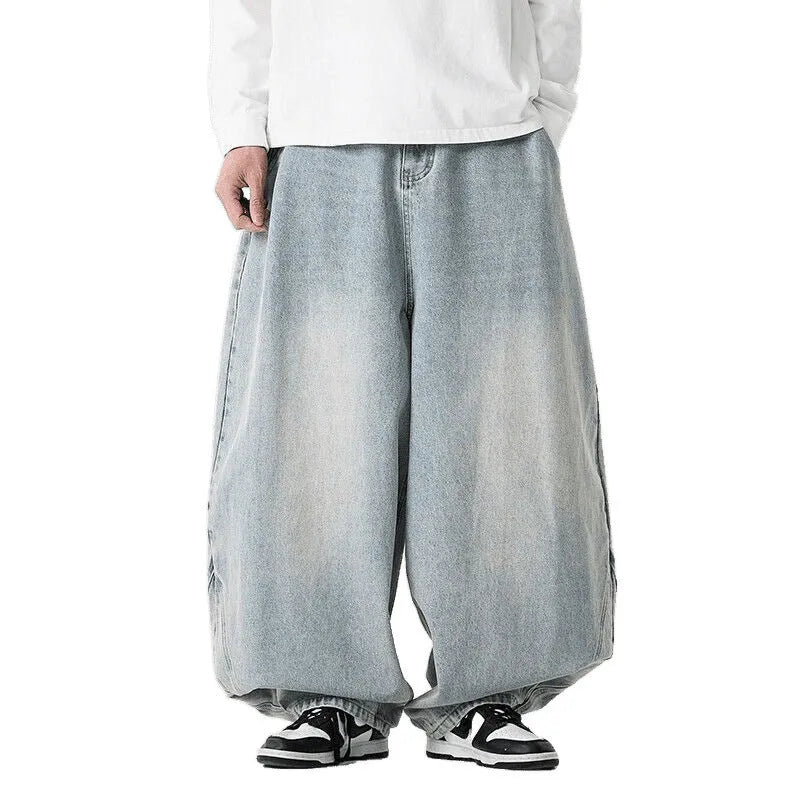 Men's plus size wide leg jeans in dark blue denim with a baggy fit and straight leg opening.