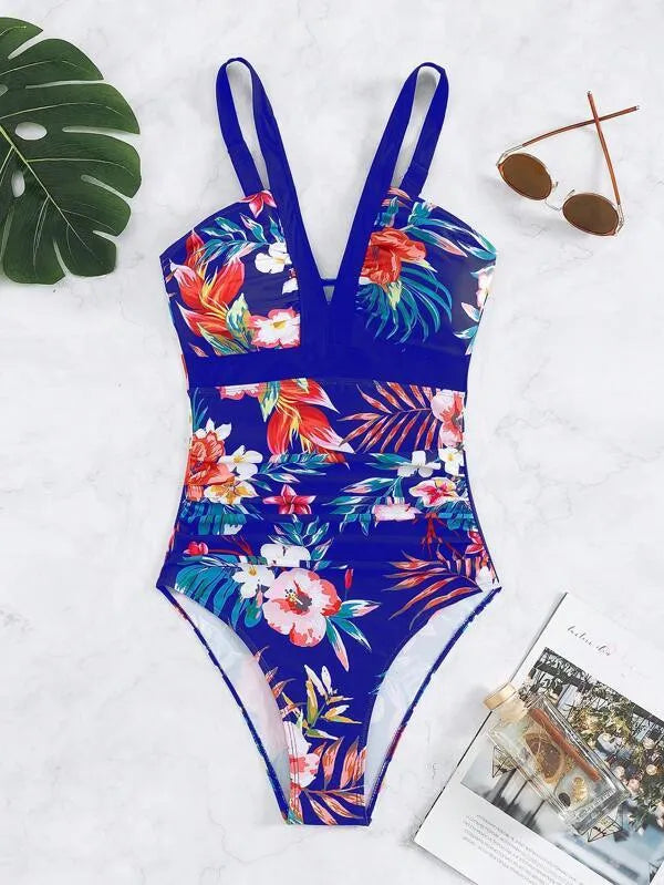 Women's black floral backless one-piece swimsuit on a mannequin