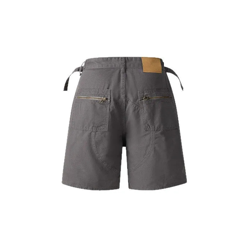 Retro washed cotton workwear shorts in loose fit and fifth pants length, shown in camouflage colour.