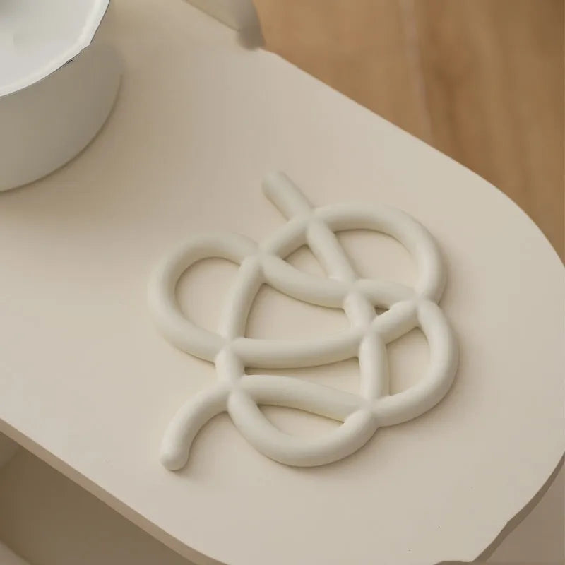 Ceramic heat proof mat in irregular shape with hook for hanging storage