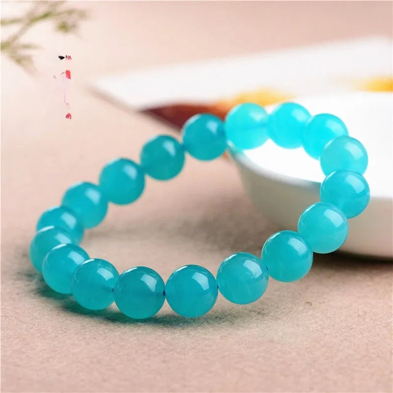 Grade 7A Amazonite natural gemstone scattered beads showing blue-green ice colouration and polished surface