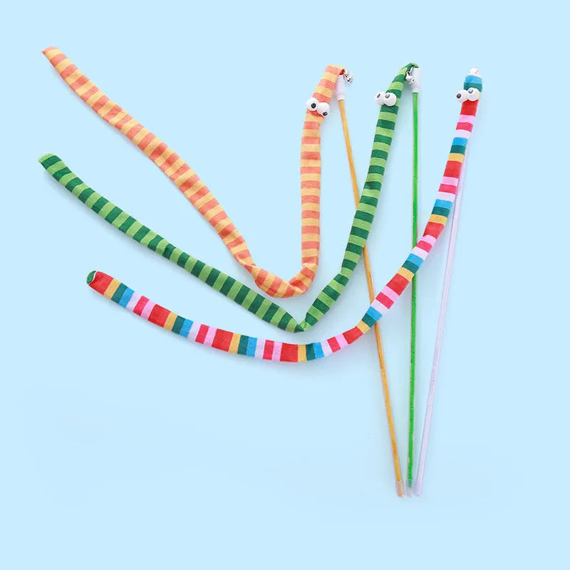 Green cat wand toy with long plush strip on a polycarbonate pole, shown mid-swing.
