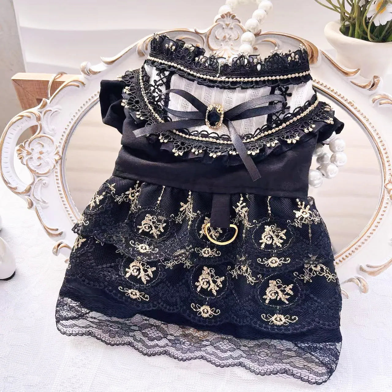 Golden gothic princess costume dress for a small dog or cat on a hanger.
