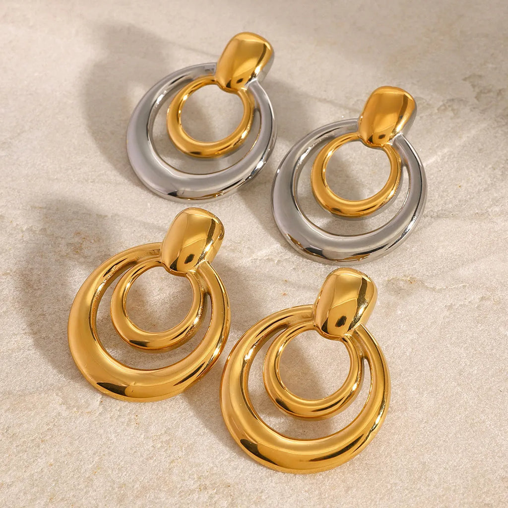 Golden round double-layer hollow stud earrings with geometric design on titanium steel