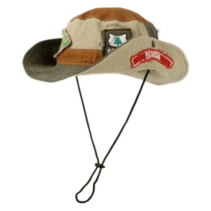Army green cotton fisherman hat with flat top crown and hand-painted patchwork details, shown folded and unfolded