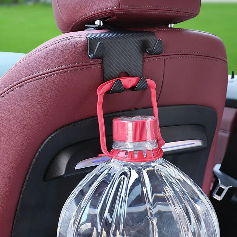 Black ABS plastic car hook with integrated mobile phone holder bracket for rear seat back.